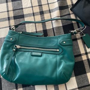 Medium teal coach purse. Lightly used basically new including verification.